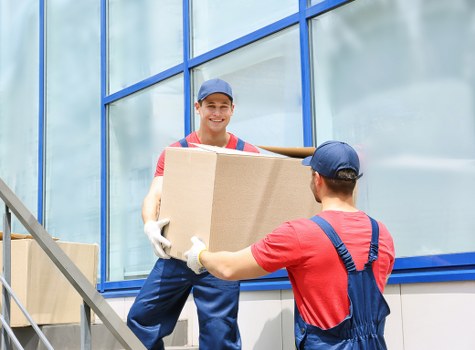 Office relocation planning in Hanwell with moving boxes and desks