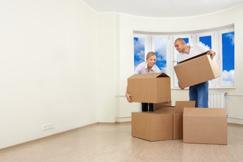 Unpacking boxes in a newly moved-in Hanwell property