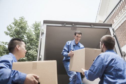 Packed moving boxes and furniture in a Hanwell property