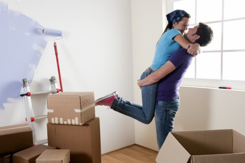 Moving boxes and household items being unloaded at a new home in Hanwell
