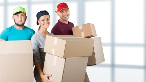 Local furniture removal team handling sofas and chairs in Hanwell