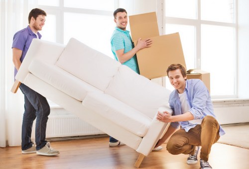 Packed office boxes and workstation items for commercial removals