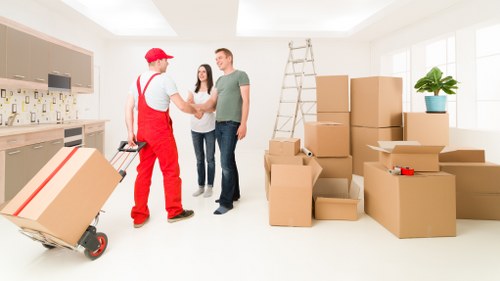 Removal team loading boxes for a flat move in Hanwell